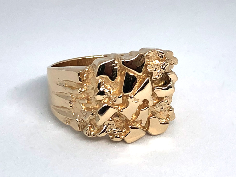 Silver ring with a gold nugget